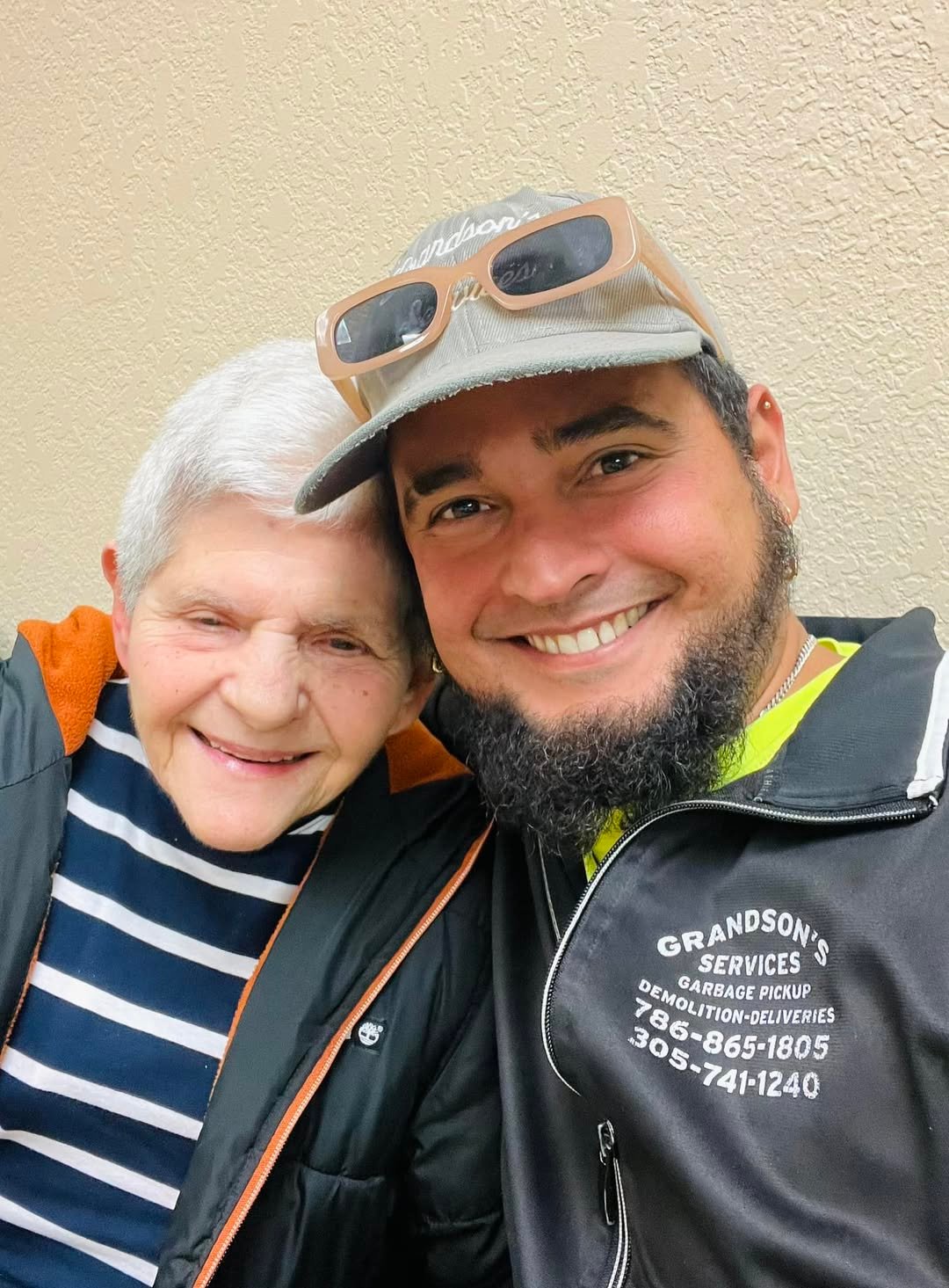 Alejandro, founder of Grandson's Services, with his grandmother
